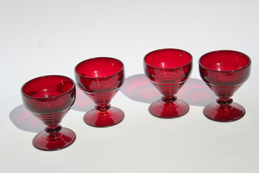 Set of five red glass goblets 